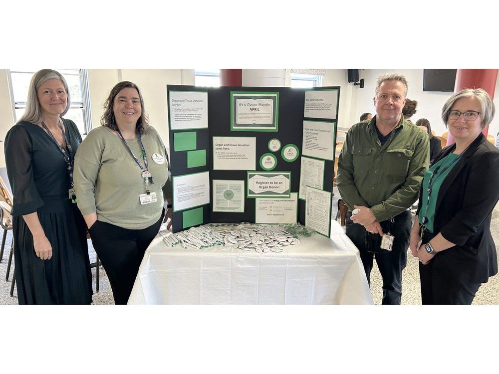 Group with organ donation display board