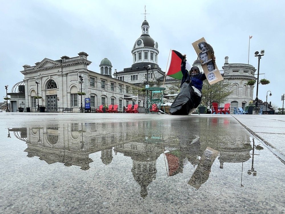 lindsey pilon sits in springer market square during the second day of her hunger strike in support of indigenous landback movement and in solidarity with palestinians. pilon has refused food, water and medicine since tuesday night in kingston, ont. on thursday, may 22, 2025. (elliot ferguson/the whig-standard/postmedia network)