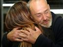 Guest Jeffery Scott Baldwin hugs the John Howard Society's lead adult service worker, Jasmine Gareau, Friday at The Bridge Integrated Care Hub in Belleville. The facility's director, Ashley Vader, say those who approach homelessness-related issues in a compassionate way are more likely to succeed.