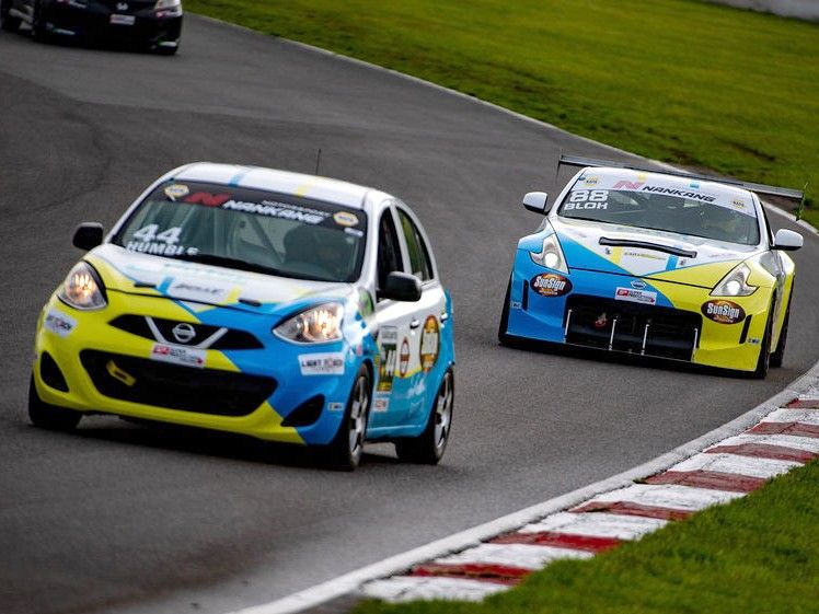 Two Nissan race cars lapping at CTMP