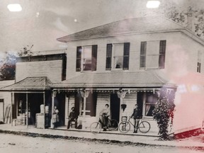 A black and white picture of an old store.