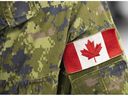 A Canadian flag on the sleeve of a member of the Canadian Armed Forces at the Decarie Square Covid-19 vaccination site in Montreal, on Wednesday, Jan. 12, 2022.