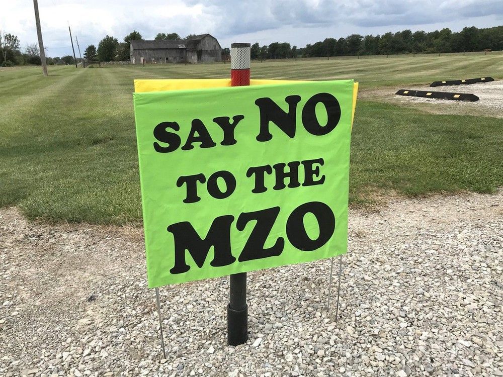 green sign opposing development