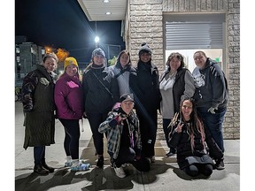 Friends gather for a bonfire in Kirkland Lake