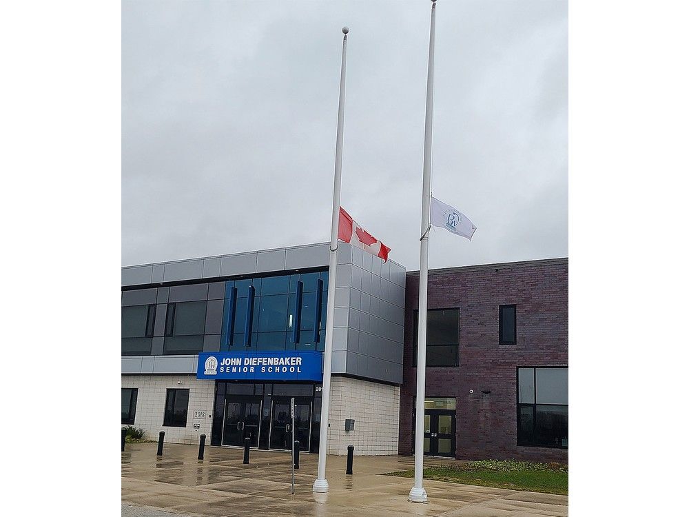  Flags fly at half-mast at John Diefenbaker senior school in Hanover on Nov. 12, 2025. (Derek Lester/Postmedia)