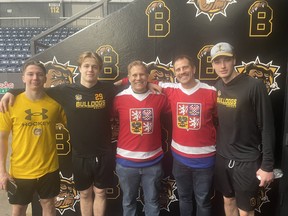 Matt Piatek (third from left) and Steve Piatek pose with Brantford Bulldogs (left tor right) Adam Benak, Vladimir Dravecky and Adam Jiricek, showing their support for the players by wearing jerseys from their home country, Czechia.