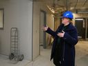 Ashley Vader, director of The Bridge Integrated Care Hub gestures during a tour of the facility's future home Friday, Dec. 12, 2025, in Belleville, Ont. Its first phase - the main floor, part of which is shown here - is to open in early spring.