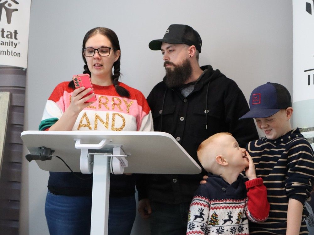 Tabatha Jenkins and Wes Derby were handed the keys to their new home Monday in Forest as a a crowd of well-wishers applauded.