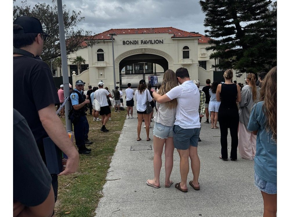 People hugging day after Bondi shooting