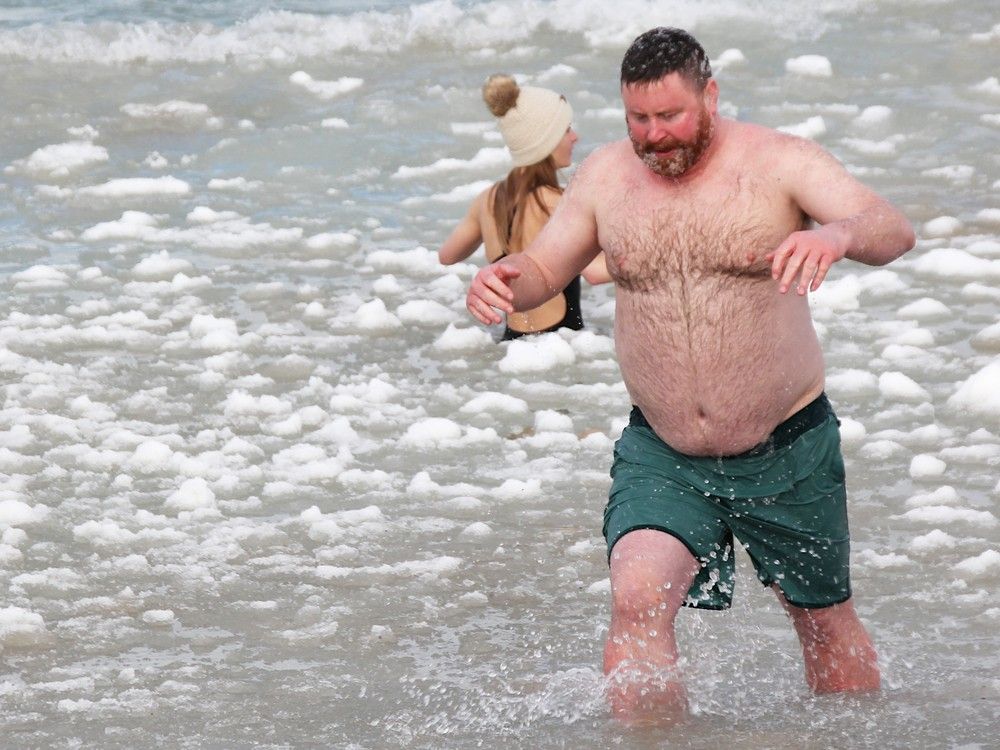 Walking up the beach, pieces of ice hanging from her hair and bathing suit, Triniti Boucher said she couldn't feel anything.