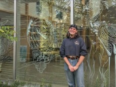 artist shows off window mural of birds