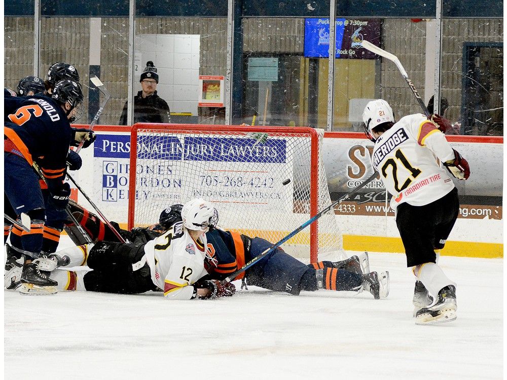 Timmins Rock forward Edan Etheridge lifts the puck up and over Soo Thunderbirds blue-liner Gianmarco Mastroianni and into the net during the first period of Friday night’s NOJHL contest at the McIntyre Arena