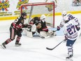 Sarnia Legionnaires goalie Zack Irvin faces a shot from Stratford Warriors’ Jonas Schmidt (22) at Pat Stapleton Arena in Sarnia, Ont., on Thursday, Jan. 22, 2026. (Shawna Lavoie Photography)