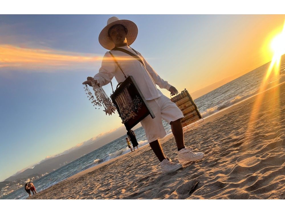  A hawker sells trinkets on the Las Glorias beach in Puerto Vallarta. The tourism industry is worth millions in the resort city.