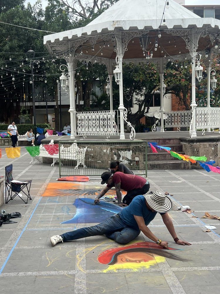  Artists draw with chalk at an annual outdoor art festival in the old town of Puerto Vallarta only days before cartel violence would shut the area down.