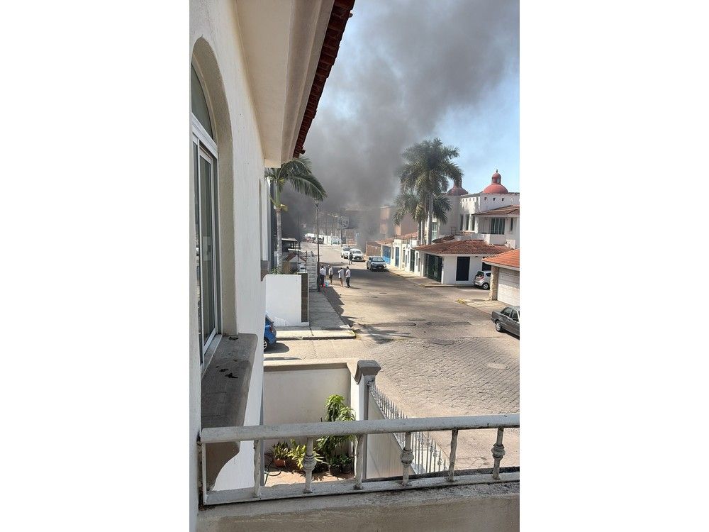  Smoke billows on Sunday from close to the villa three Canadian families had rented in Puerto Vallarta.