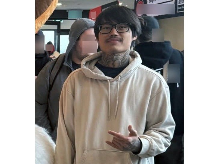 Police have issued an updated photo of the person sought in a Canada-wide manhunt linked to the on-campus college bar shooting in Sarnia.