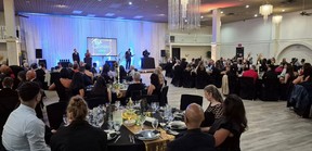 The gathering at the Everest Convention Centre is shown. (Trevor Terfloth/The Daily News)