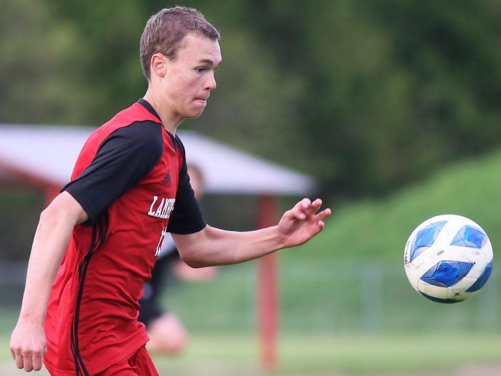 Lambton-Kent's Max Taylor (13) chases the ball in the LKSSAA senior boys A soccer final against Tilbury at Lambton-Kent Composite School in Dresden, Ont., on Thursday, May 21, 2026. Mark Malone/Chatham Daily News/Postmedia Network