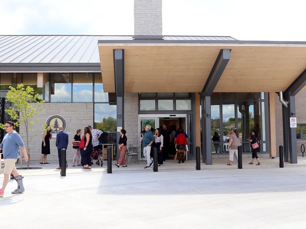 People outside large brick building