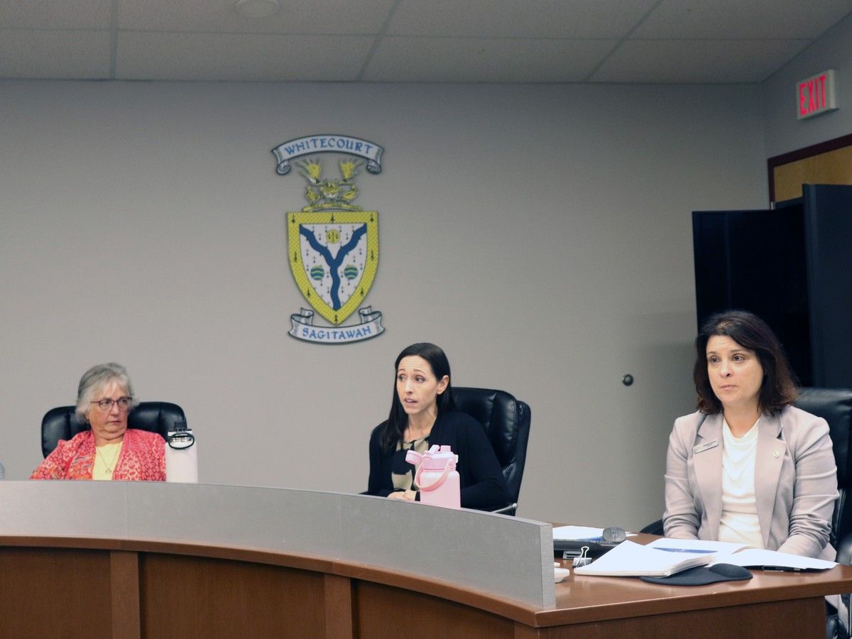 Town staff and a Soaring Eagle rep sit at council table