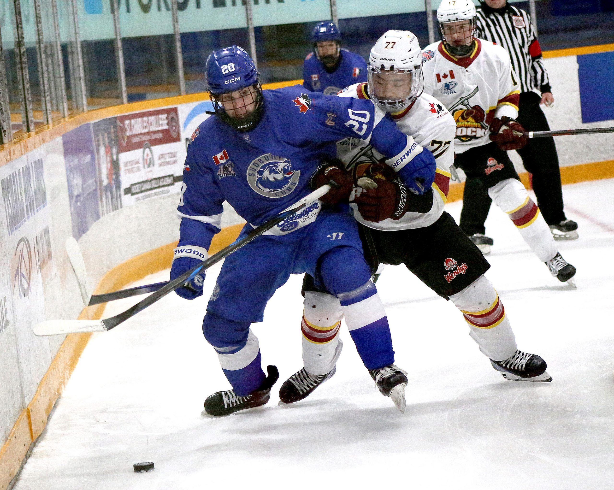 Greater Sudbury Cubs forward Caden Dubreuil (20) battles for position with Timmins Rock defender Matthew Kim (77) during NOJHL action at Gerry McCrory Countryside Sports Complex in Sudbury, Ont. on Friday, April 17, 2025.