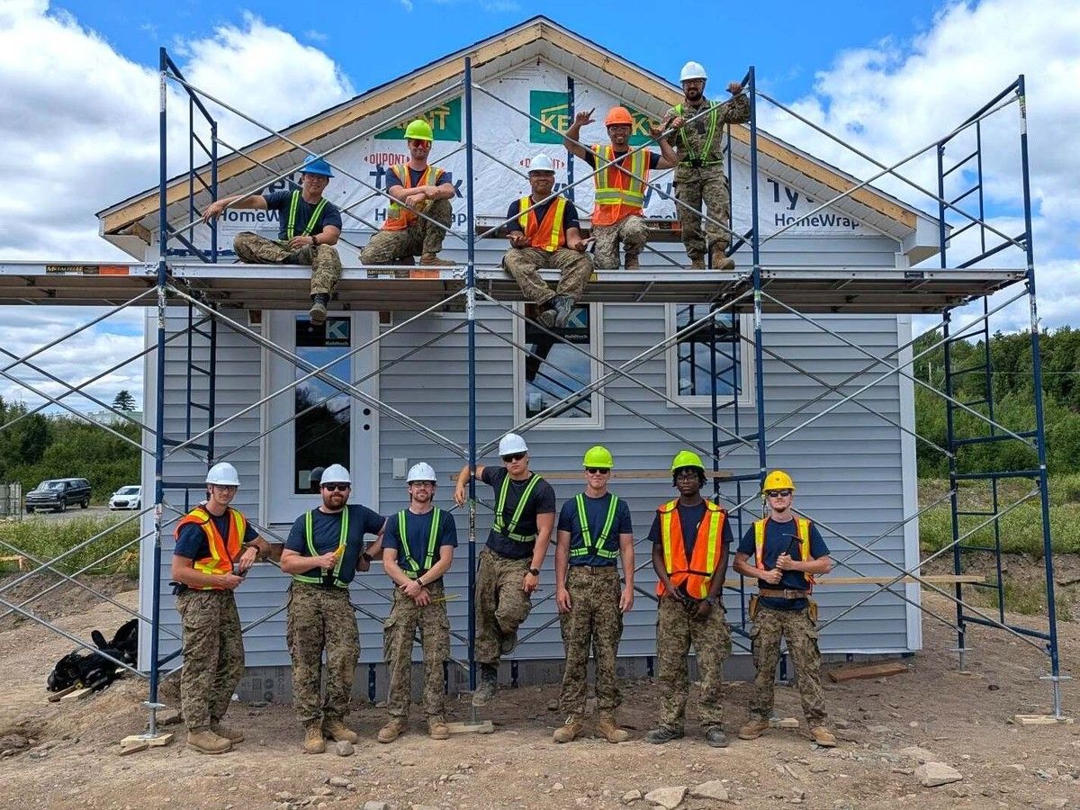 Military regiment pitches in to build Habitat home