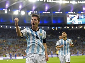 Argentina's forward and captain Lionel Messi celebrates scoring during a Group F football match between Argentina and Bosnia-Hercegovina at the Maracana Stadium in Rio De Janeiro during the 2014 FIFA World Cup on June 15, 2014. (JUAN MABROMATA/AFP/Getty Images)