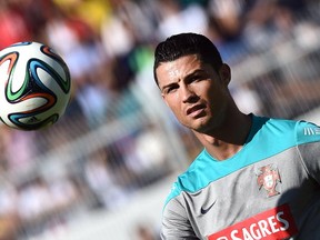 Portugal's forward Cristiano Ronaldo controls the ball as he takes part in a team training session in Campinas, Sao Paulo, on June 18, 2014, during the 2014 FIFA World Cup. 
JEWEL SAMAD/AFP/Getty Images