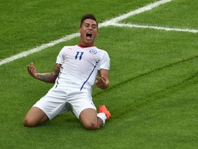 Chile's forward Eduardo Vargas celebrates after scoring their first goal during a Group B football match between Spain and Chile in the Maracana Stadium in Rio de Janeiro during the 2014 FIFA World Cup on June 18, 2014.  (YASUYOSHI CHIBA/AFP/Getty Images)