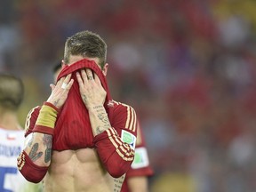 Spain defender Sergio Ramos reacts during a Group B match against Chile in the Maracana Stadium in Rio de Janeiro during the FIFA World Cup on Wednesday. With a 2-0 loss, Spain's hopes of retaining its World Cup title were ended.