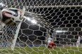 TOPSHOTS  Bosnia-Hercegovina's goalkeeper Asmir Begovic (C) concedes a goal to Nigeria's forward Peter Odemwingie during the Group F football match between Nigeria and Bosnia-Hercegovina at the Pantanal Arena in Cuiaba during the 2014 FIFA World Cup on June 21, 2014.  AFP PHOTO / JUAN BARRETOJUAN BARRETO/AFP/Getty Images