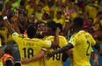 Colombia's midfielder James Rodriguez (C) celebrates scoring the 2-0 goal with his teammates during the Round of 16 football match between Colombia and Uruguay at the Maracana Stadium in Rio de Janeiro during the 2014 FIFA World Cup in Brazil on June 28, 2014. (LUIS ACOSTA/AFP/Getty Images)