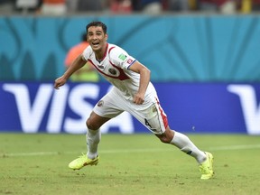 Costa Rica's defender Michael Umana celebrates after wining a Round of 16 football match between Costa Rica and Greece at Pernambuco Arena in Recife during the 2014 FIFA World Cup on June 29, 2014.  AFP PHOTO / ARIS MESSINISARIS MESSINIS/AFP/Getty Images