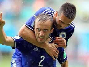 Avdija Vrsajevic of Bosnia and Herzegovina celebrates scoring his team's third goal during the 2014 FIFA World Cup Brazil Group F match between Bosnia and Herzegovina and Iran at Arena Fonte Nova on June 25, 2014 in Salvador, Brazil.  (Photo by Felipe Oliveir/Getty Images)