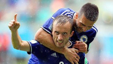 Avdija Vrsajevic of Bosnia and Herzegovina celebrates scoring his team's third goal during the 2014 FIFA World Cup Brazil Group F match between Bosnia and Herzegovina and Iran at Arena Fonte Nova on June 25, 2014 in Salvador, Brazil.  (Photo by Felipe Oliveir/Getty Images)