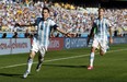 Argentina's Lionel Messi, left, celebrates after scoring during the group F World Cup soccer match between Argentina and Iran at the Mineirao Stadium in Belo Horizonte, Brazil, Saturday, June 21, 2014. (AP Photo/Jon Super)