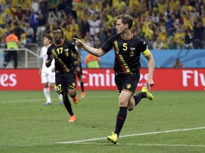 Belgium's Jan Vertonghen celebrates after scoring his side's first goal during the group H World Cup soccer match between South Korea and Belgium at the Itaquerao Stadium in Sao Paulo, Brazil, Thursday, June 26, 2014.(AP Photo/Thanassis Stavrakis)