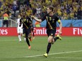 Belgium's Jan Vertonghen celebrates after scoring his side's first goal during the group H World Cup soccer match between South Korea and Belgium at the Itaquerao Stadium in Sao Paulo, Brazil, Thursday, June 26, 2014.(AP Photo/Thanassis Stavrakis)