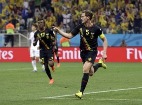 Belgium's Jan Vertonghen celebrates after scoring his side's first goal during the group H World Cup soccer match between South Korea and Belgium at the Itaquerao Stadium in Sao Paulo, Brazil, Thursday, June 26, 2014.(AP Photo/Thanassis Stavrakis)