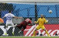 Portugal's Silvestre Varela heads the ball past United States' goalkeeper Tim Howard to score his side's second goal and tie the game 2-2 during the group G World Cup soccer match between the USA and Portugal at the Arena da Amazonia in Manaus, Brazil, Sunday, June 22, 2014. (AP Photo/Martin Mejia)