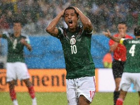 Giovani dos Santos of Mexico reacts after his goal was disallowed. (Matthias Hangst/Getty Images)