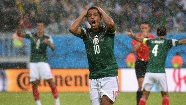 Giovani dos Santos of Mexico reacts after his goal was disallowed. (Matthias Hangst/Getty Images)