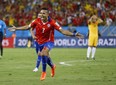 Chile's Alexis Sanchez (7) celebrates after scoring his side's first goal  (Associated Press/Kirsty Wigglesworth)