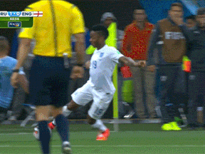 Raheem Sterling of England and Alvaro Pereira of Uruguay meet in the middle in the worst way possible. (GIF courtesy The Score and CBC)