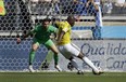 Colombia's Pablo Armero, right, kicks the ball at Greece's goalkeeper Orestis Karnezis to score his side's first goal during the group C World Cup soccer match between Colombia and Greece at the Mineirao Stadium in Belo Horizonte, Brazil, Saturday, June 14, 2014. (AP Photo/Fernando Vergara)