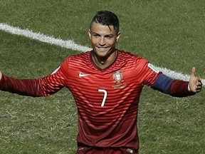 Portugal's Cristiano Ronaldo reacts after missing a shot during the group G World Cup soccer match between Portugal and Ghana at the Estadio Nacional in Brasilia, Brazil, Thursday, June 26, 2014. (AP Photo/Themba Hadebe)