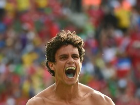 Costa Rica's midfielder Yeltsin Tejeda celebrates after a Group D football win over Italy. (EMMANUEL DUNAND/AFP/Getty Images)