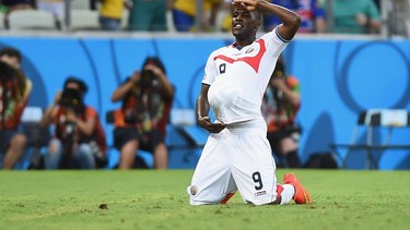 Joel Campbell of Costa Rica celebrates scoring his team's first goal with the ball.  (Photo by Laurence Griffiths/Getty Images)