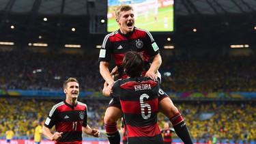 Toni Kroos of Germany celebrates scoring his team's fourth goal with teammates Miroslav Klose, left, and Sami Khedira during the World Cup Brazil semifinal match between Brazil and Germany at Estadio Mineirao on July 8, 2014 in Belo Horizonte, Brazil.  (Photo by Buda Mendes/Getty Images)